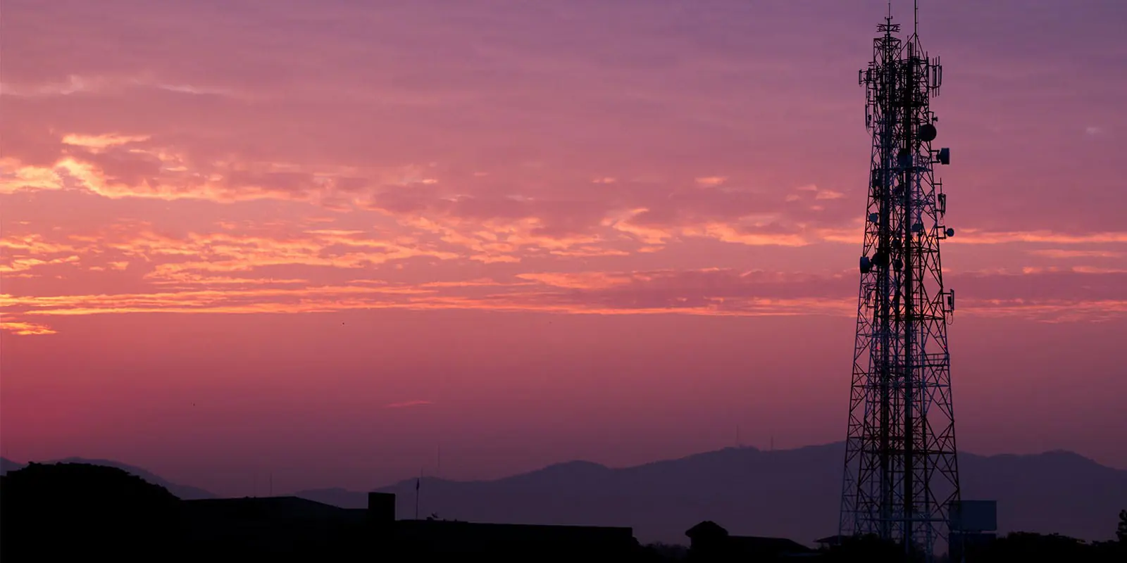 Communications tower at sunrise